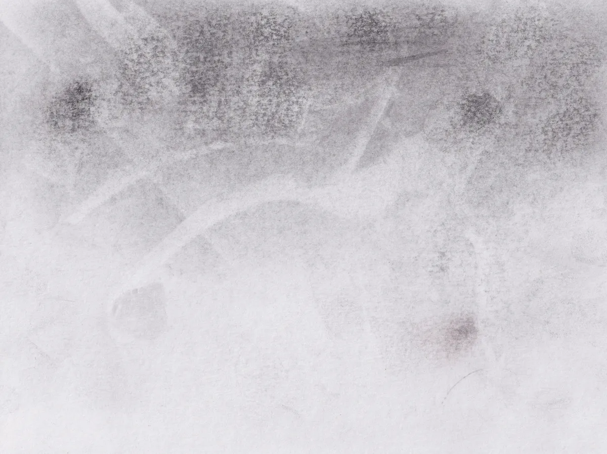 Very pale smudged graphite on white paper, darkening to a grainy band with soft spots along the top