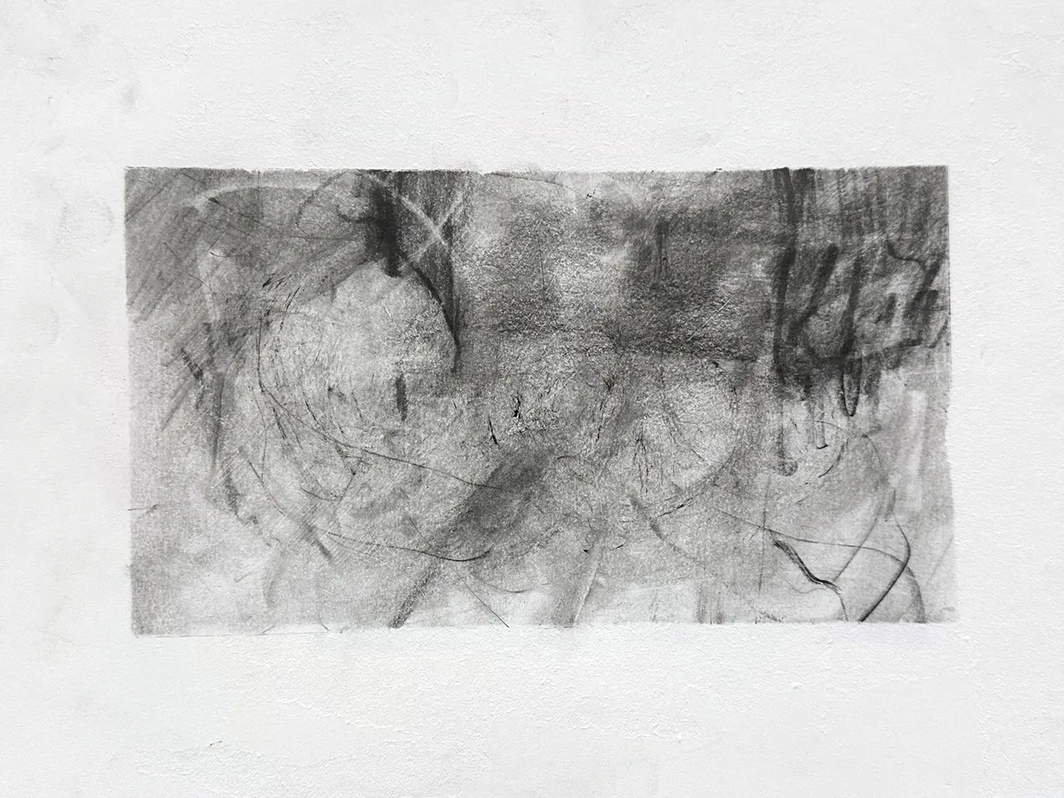 Wide graphite drawing on white paper: a smoky grey ground of looping ovals and scratched lines, darkest across the top, with dense dripping vertical strokes at the right