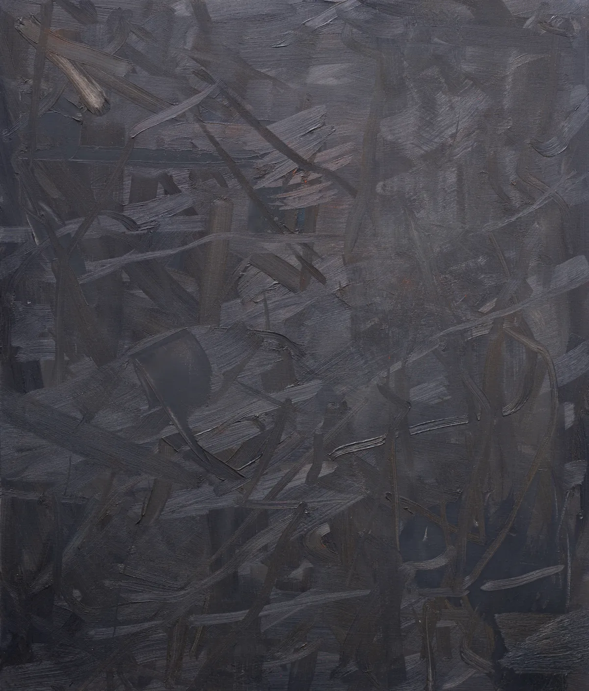 Upright canvas of near-black worked in thick crossing strokes, their ridges catching the light grey, with a single pale fleck at the upper left